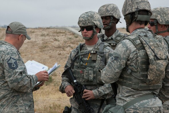 Members of the 307th Security Forces Squadron are briefed on the rules before the start of the Weapons Firing Challenge on Sept. 23, 2015, Camp Guernsey Joint Training Center, Wyo. The challenge consists of teams being evaluated on their marksmanship using the M4 rifle, M9 pistol, M240 machine gun and the M203 grenade launcher. (U.S. Air Force photo by Master Sgt. Greg Steele/Released)