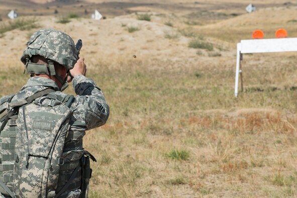 A member of the 307th Security Forces Squadron fires his M9 pistol during the Weapons Firing Challenge on Sept. 23, 2015, Camp Guernsey Joint Training Center, Wyo. The challenge consists of teams being evaluated on their marksmanship using the M4 rifle, M9 pistol, M240 machine gun and the M203 grenade launcher. (U.S. Air Force photo by Master Sgt. Greg Steele/Released)