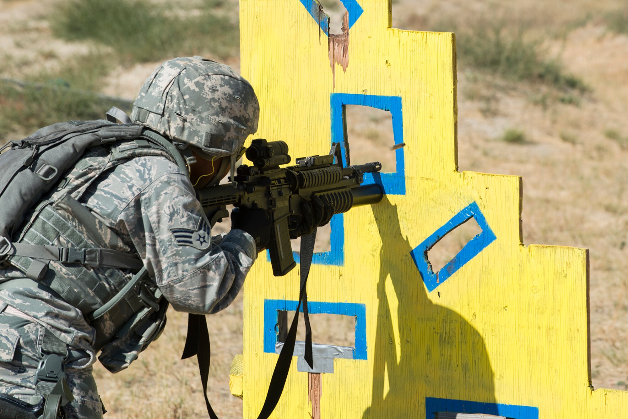 A member of the 307th Security Forces Squadron fires his M4 rifle during the Weapons Firing Challenge on Sept. 23, 2015, Camp Guernsey Joint Training Center, Wyo. The challenge consists of teams being evaluated on their marksmanship using the M4 rifle, M9 pistol, M240 machine gun and the M203 grenade launcher. (U.S. Air Force photo by Master Sgt. Greg Steele/Released)