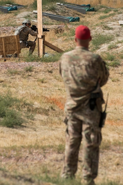 A member of the 307th Security Forces Squadron fires his M4 rifle during the Weapons Firing Challenge on Sept. 23, 2015, Camp Guernsey Joint Training Center, Wyo. The challenge consists of teams being evaluated on their marksmanship using the M4 rifle, M9 pistol, M240 machine gun and the M203 grenade launcher. (U.S. Air Force photo by Master Sgt. Greg Steele/Released)