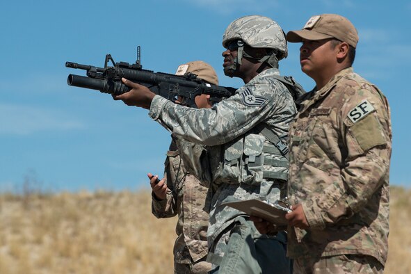 U.S. Air Force Staff Sgt. Joshua Hill, 307th Security Forces Squadron, prepares to fire his M203 grenade launcher during the Weapons Firing Challenge on Sept. 23, 2015, Camp Guernsey Joint Training Center, Wyo. The challenge consists of teams being evaluated on their marksmanship using the M4 rifle, M9 pistol, M240 machine gun and the M203 grenade launcher. (U.S. Air Force photo by Master Sgt. Greg Steele/Released)
