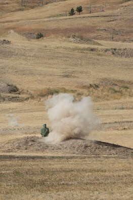 Bullets from a M240 machine gun impact the target after being fired by a member of the 307th Security Forces Squadron during the Weapons Firing Challenge on Sept. 23, 2015, Camp Guernsey Joint Training Center, Wyo. The challenge consists of teams being evaluated on their marksmanship using the M4 rifle, M9 pistol, M240 machine gun and the M203 grenade launcher. (U.S. Air Force photo by Master Sgt. Greg Steele/Released)