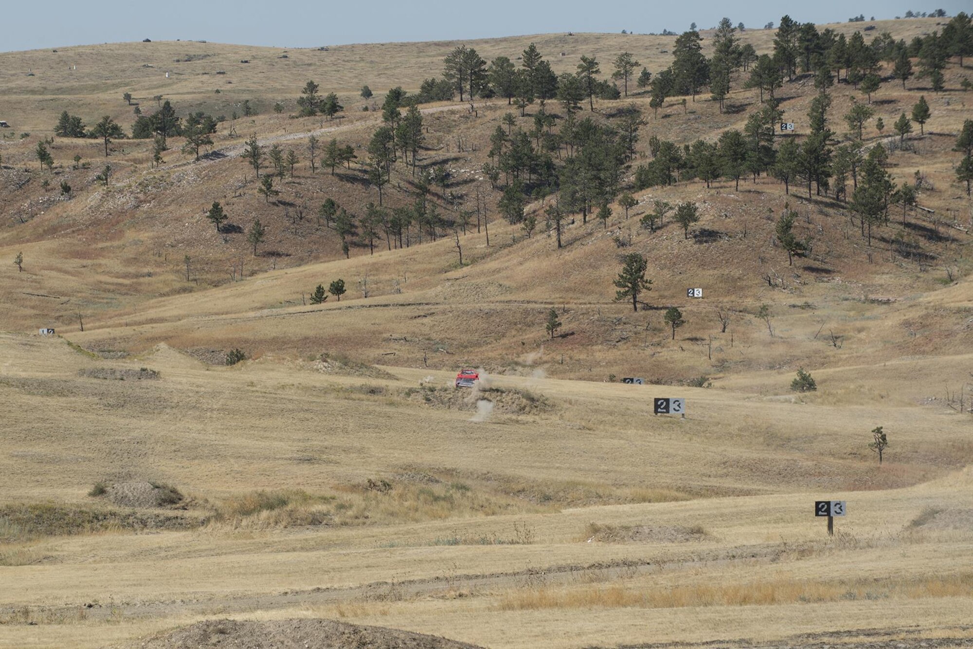 Bullets from a M240 machine gun impact the target after being fired by a member of the 307th Security Forces Squadron during the Weapons Firing Challenge on Sept. 23, 2015, Camp Guernsey Joint Training Center, Wyo. The challenge consists of teams being evaluated on their marksmanship using the M4 rifle, M9 pistol, M240 machine gun and the M203 grenade launcher. (U.S. Air Force photo by Master Sgt. Greg Steele/Released)
