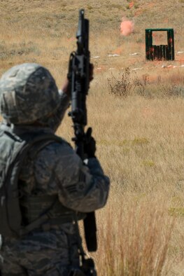 A member of the 307th Security Forces Squadron fires the M203 grenade launcher during the Weapons Firing Challenge on Sept. 23, 2015, Camp Guernsey Joint Training Center, Wyo. The challenge consists of teams being evaluated on their marksmanship using the M4 rifle, M9 pistol, M240 machine gun and the M203 grenade launcher. (U.S. Air Force photo by Master Sgt. Greg Steele/Released)