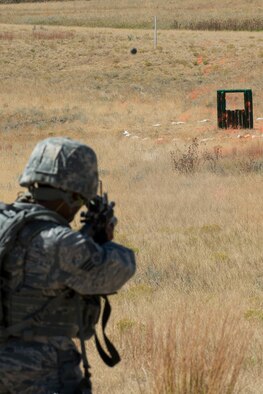 An M203 grenade can be seen just prior to impact after being fired by a member of the 307th Security Forces Squadron during the Weapons Firing Challenge on Sept. 23, 2015, Camp Guernsey Joint Training Center, Wyo. The challenge consists of teams being evaluated on their marksmanship using the M4 rifle, M9 pistol, M240 machine gun and the M203 grenade launcher. (U.S. Air Force photo by Master Sgt. Greg Steele/Released)