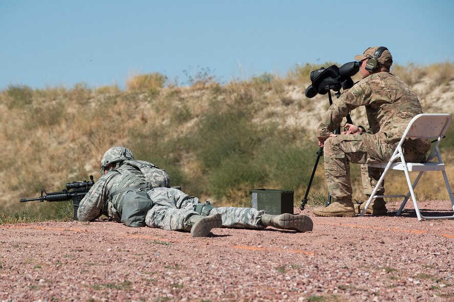 A member of the 307th Security Forces Squadron competes in the designated marksman competition during the Weapons Firing Challenge on Sept. 23, 2015, Camp Guernsey Joint Training Center, Wyo. The challenge consists of teams being evaluated on their marksmanship using the M4 rifle, M9 pistol, M240 machine gun and the M203 grenade launcher. (U.S. Air Force photo by Master Sgt. Greg Steele/Released)