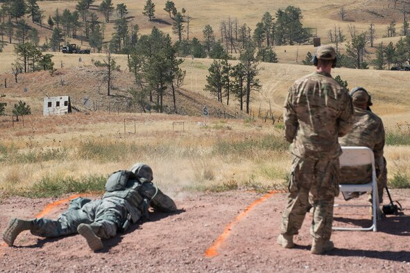 A member of the 307th Security Forces Squadron competes in the designated marksman competition during the Weapons Firing Challenge on Sept. 23, 2015, Camp Guernsey Joint Training Center, Wyo. The challenge consists of teams being evaluated on their marksmanship using the M4 rifle, M9 pistol, M240 machine gun and the M203 grenade launcher. (U.S. Air Force photo by Master Sgt. Greg Steele/Released)