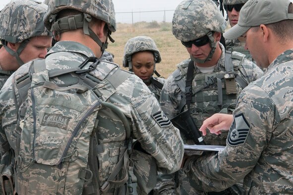 Members of the 307th Security Forces Squadron are briefed on the rules for the Warrior Run Challenge on Sept. 25, 2015, Camp Guernsey Joint Training Center, Wyo. The challenge consists of a team run, a HUMVEE push and a buddy carry through the finish line. (U.S. Air Force photo by Master Sgt. Greg Steele/Released)