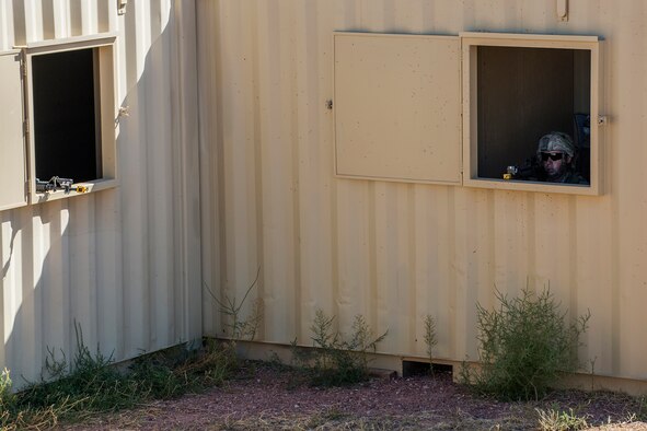 Members of the 307th Security Forces Squadron secure a building during the Capture and Recovery Challenge on Sept. 24, 2015, Camp Guernsey Joint Training Center, Wyo. The challenge consists of teams eliminating enemy threats and securing a nuclear asset. (U.S. Air Force photo by Master Sgt. Greg Steele/Released)