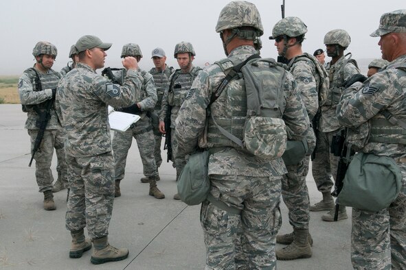 Security Forces members are briefed on the rules for the Warrior Run Challenge on Sept. 25, 2015, Camp Guernsey Joint Training Center, Wyo. The challenge consists of a team run, a HUMVEE push and a buddy carry through the finish line. (U.S. Air Force photo by Master Sgt. Greg Steele/Released)