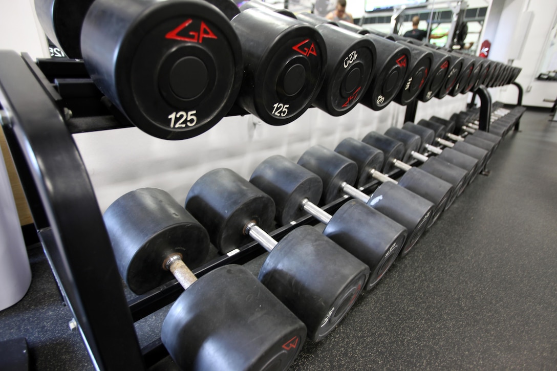 Dumbbells are lined up on a weight rack in the Hancock gym at Marine Corps Air Station Cherry Point, Sept. 27, 2015.  The Hancock gym and Devil Dog gym’s hours will increase by more than 40 hours per week beginning Oct. 1, 2015, collectively between the two fitness facilities. The change in hours comes from the concerns of Marines on the air station being heard by their senior leadership. (U.S. Marine Corps photo by Lance Cpl. Jason Jimenez/Released)
