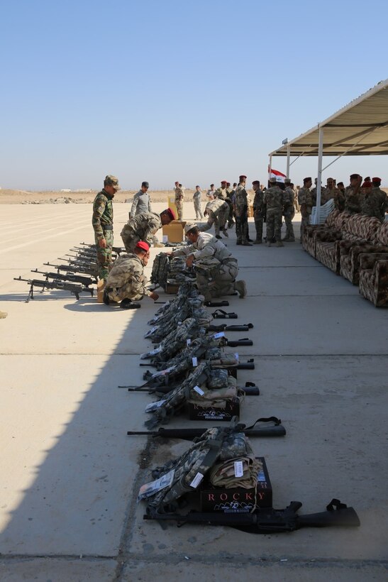 New sets of NATO equipment, procured and issued through the Iraq Train and Equip Fund, await Popular Mobilization Program soldiers after a graduation ceremony at Al Taqaddum Air Base, Iraq, Sept. 3, 2015. The Popular Mobilization Program is an Iraqi-led, Operation Inherent Resolve program that trains volunteer tribal forces in leadership, small unit tactics and urban warfare to ultimately serve with Iraqi Security Forces in their battle to defeat the Islamic State of Iraq and the Levant and ensure the safety and security of its citizens. (U.S. Marine Corps photo by Cpl. John Baker / released)