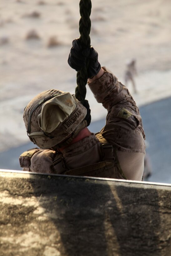 U.S. Marine Lance Cpl. Duane Bierman, a machine gunner with India Company, 3rd Battalion, 7th Marine Regiment, Special Purpose Marine Air-Ground Task Force—Crisis Response—Central Command, fast ropes from an MV-22 Osprey during training while deployed to Southwest Asia, Sept. 16, 2015. Fast roping allows Marines to insert ground forces quickly from the air, without the need for a stabilized landing zone. The Marines and Sailors of SPMAGTF-CR-CC provide the commander of USCENTCOM with a unique set of solutions to emergent crises across a broad swath of the Middle East. (U.S. Marine Corps Photo by Cpl. Leah Agler/RELEASED)