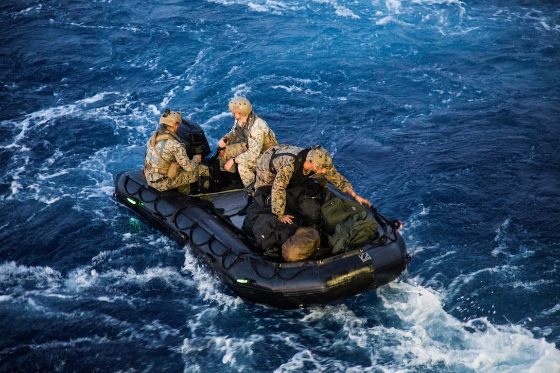 U.S. Marines with the Maritime Raid Force, 13th Marine Expeditionary Unit (MEU), 1st Marine Expeditionary Force, disembark from the USS New Orleans utilizing a combat rubber raid craft during the PHIBRON-MEU integration exercise off the coast of San Clemente Island, Sept. 25, 2015. This marks the first at-sea exercise for the PHIBRON-MEU Marines and Sailors as they work together in preparation for deployment to the Pacific and Central Command areas of responsibility in early 2016. (U.S. Marine Corps photo by Sgt. Tyler C. Gregory/released)