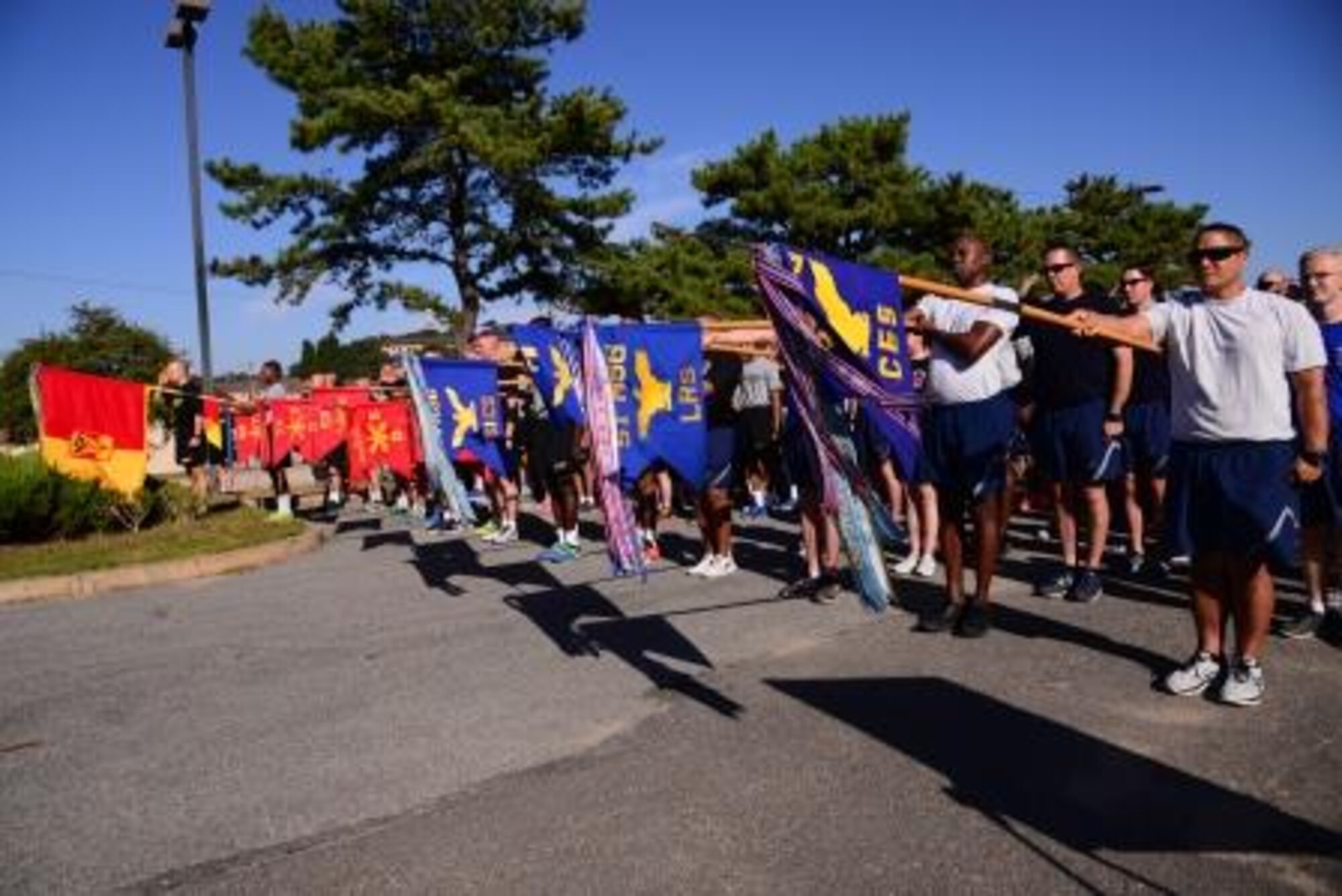 Members of Team Osan salute the flag to start the Osan Cup Sept. 29, 2015, at Osan Air Base, Republic of Korea. The competition was intended to celebrate fitness both mentally and physically, while being tested in a variety of games and challenges. (U.S. Air Force photo by Staff Sgt. Benjamin Sutton)