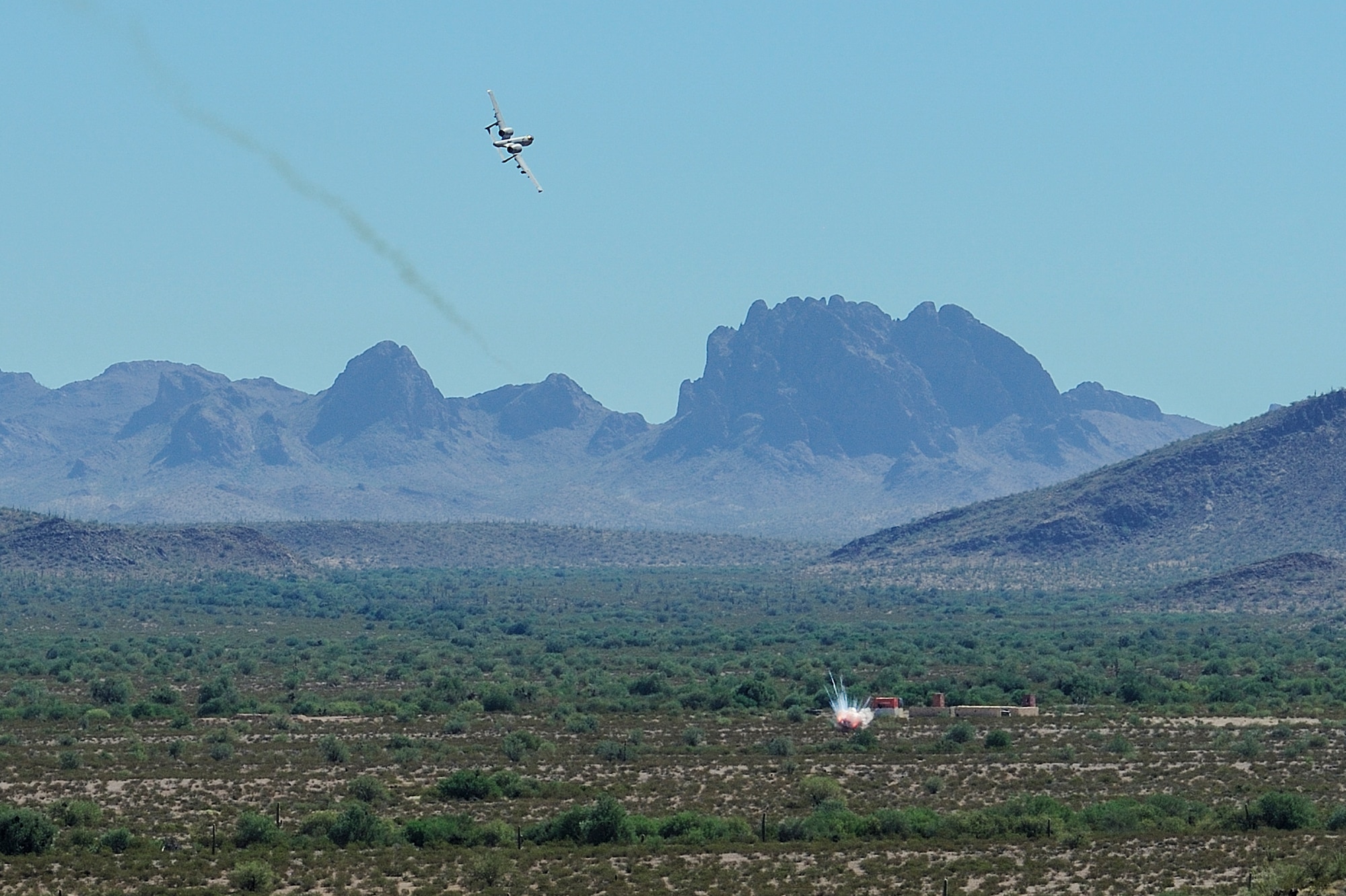 A U.S. Air Force A-10C Thunderbolt II assigned to the 357th Fighter Squadron eliminates a target while utilizing the guidance of British Armed Forces joint tactical air controllers at Barry M. Goldwater Range, Ariz., Sept. 23, 2015. The British Armed Forces JTACs are the link between air and ground communications and are charged with ensuring that they can direct any ordnance that leaves an aircraft while protecting civilians and friendly troops at all times. (U.S. Air Force photo by Airman 1st Class Chris Drzazgowski/Released)