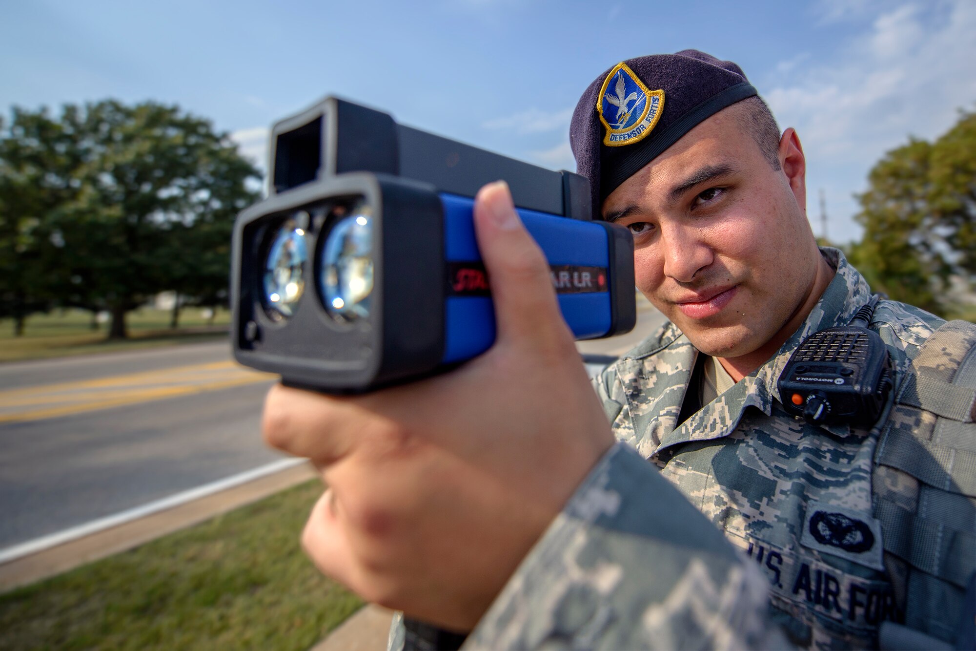 Staff Sgt. Eric Salazar monitors vehicle speeds at Vance Air Force Base, Oklahoma, Sept. 29. Salazar is a Defender with Vance's 71st Security Forces Squadron. (U.S. Air Force photo / David Poe)