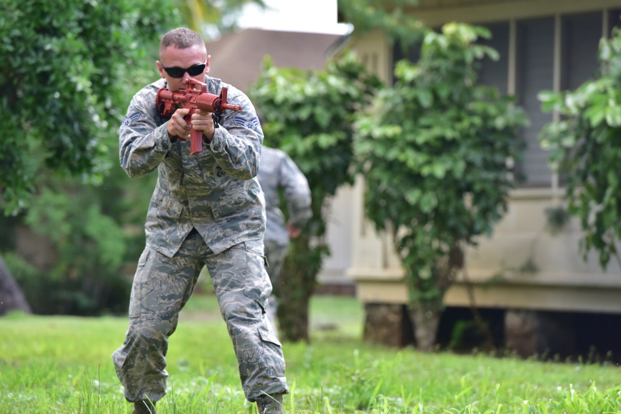 Senior Airman Jesse Johnson, 647th Security Forces Squadron patrolman, defends his fellow Airmen while they escape an overrun position during Air Force Fly-Away Security Team training, or FAST, Sept. 25, 2015, at Joint Base Pearl Harbor-Hickam. FAST provides forward-deploying Airmen the opportunity to enhance specific skills in the areas of security, mission planning, threat assessments, and combatives. The training intertwines various skill sets and teaches selectees how to be security police, ambassadors, and humanitarians at the same time. (U.S. Air Force photo by Staff Sgt. Christopher Stoltz/Released)