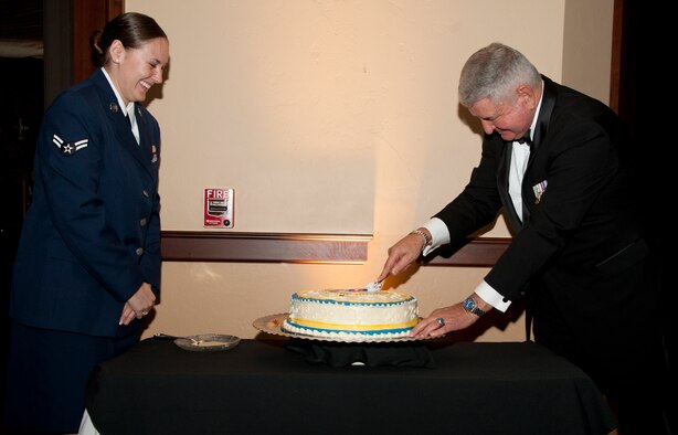 Retired Gen. Ronald Fogleman, the Air Force Chief of Staff from October 1994 to August 1997, and Airman 1st Class Danica Gendron, cut the ceremonial cake at the Vance Air Force Base Birthday Ball at Oakwood Country Club in Enid, Oklahoma, Sept. 25. Gendron, a 71st Comptroller Squadron customer service technician and the youngest Airman present, cut the cake first and Fogleman, the oldest Airman present cut the cake second. (U.S. Air Force photo / Tech. Sgt. James Bolinger)