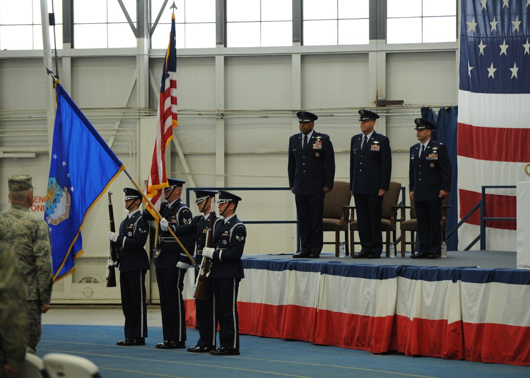 Honor Guardsmen from the 28th Bomb Wing present the colors during a B-1 realignment ceremony at Ellsworth Air Force Base, S.D., Sept. 28, 2015. The ceremony included commentaries from Maj. Gen. Richard Clark, Eighth Air Force commander, and Col. Gentry Boswell, 28th Bomb Wing commander, in regards to the transition bringing all bomber wings together under one command. (U.S. Air Force photo by Airman Sadie Colbert/Released)