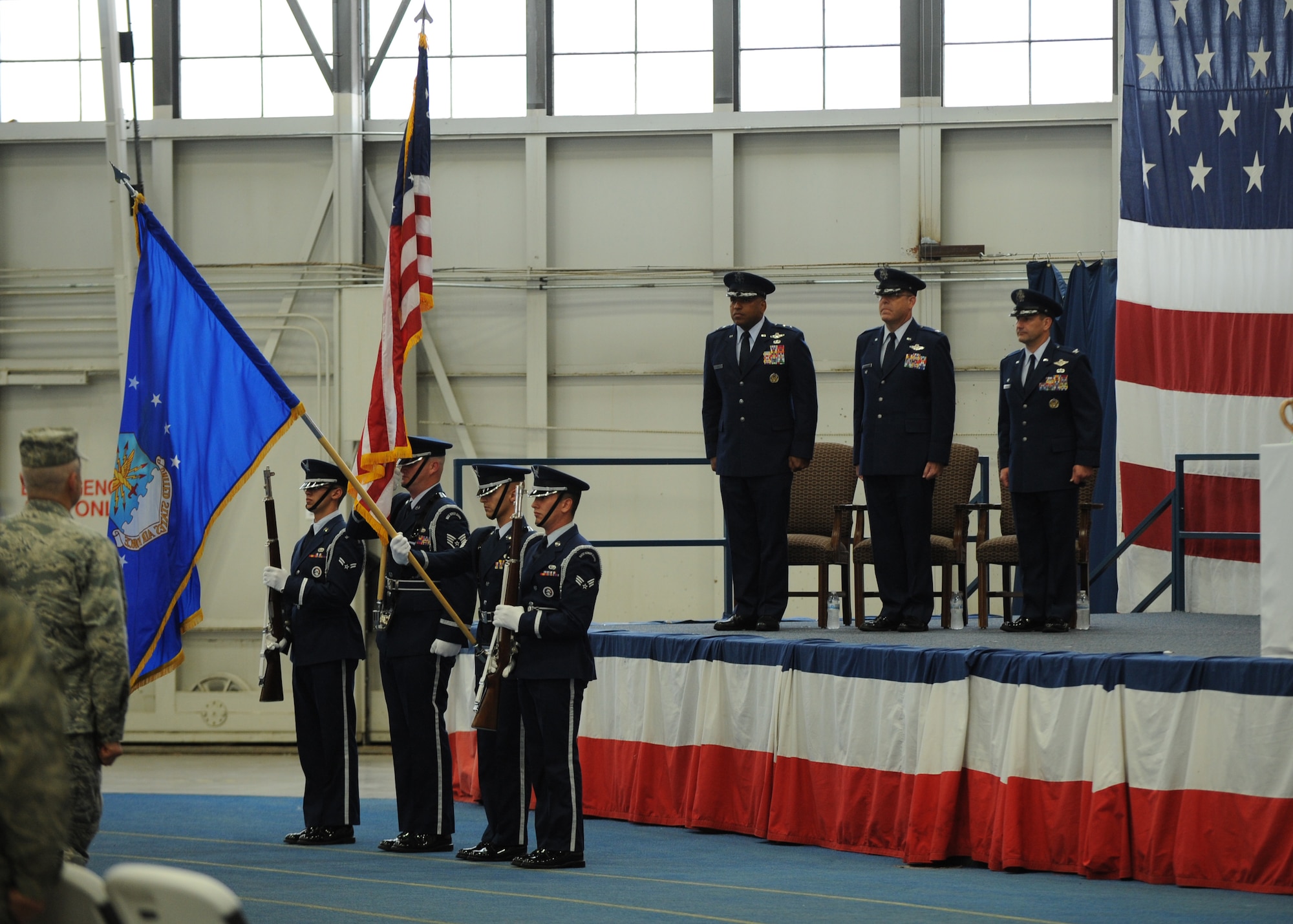 Honor Guardsmen from the 28th Bomb Wing present the colors during a B-1 realignment ceremony at Ellsworth Air Force Base, S.D., Sept. 28, 2015. The ceremony included commentaries from Maj. Gen. Richard Clark, Eighth Air Force commander, and Col. Gentry Boswell, 28th Bomb Wing commander, in regards to the transition bringing all bomber wings together under one command. (U.S. Air Force photo by Airman Sadie Colbert/Released)