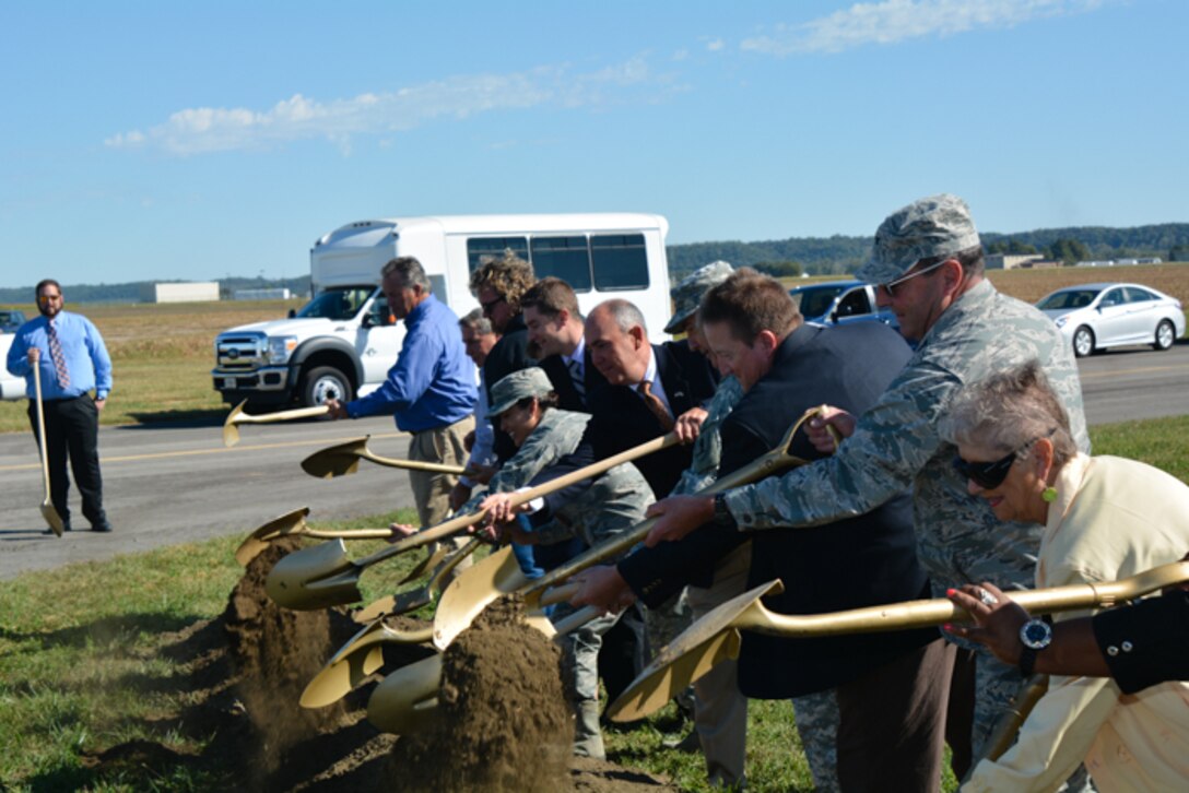 Maj. Gen. Steve Danner, Missouri National Guard adjutant general, along with local civic leaders from the community shovel dirt at Rosecrans Air National Guard Base, St. Joseph, Mo., on Sep. 30, 2015.  The city of St. Joseph and the 139th Airlift Wing host a groundbreaking event to start renovation for a new assault landing strip used to train pilots for short landings and take offs. (U.S. Air National Guard photo by Senior Airman Bruce Jenkins)