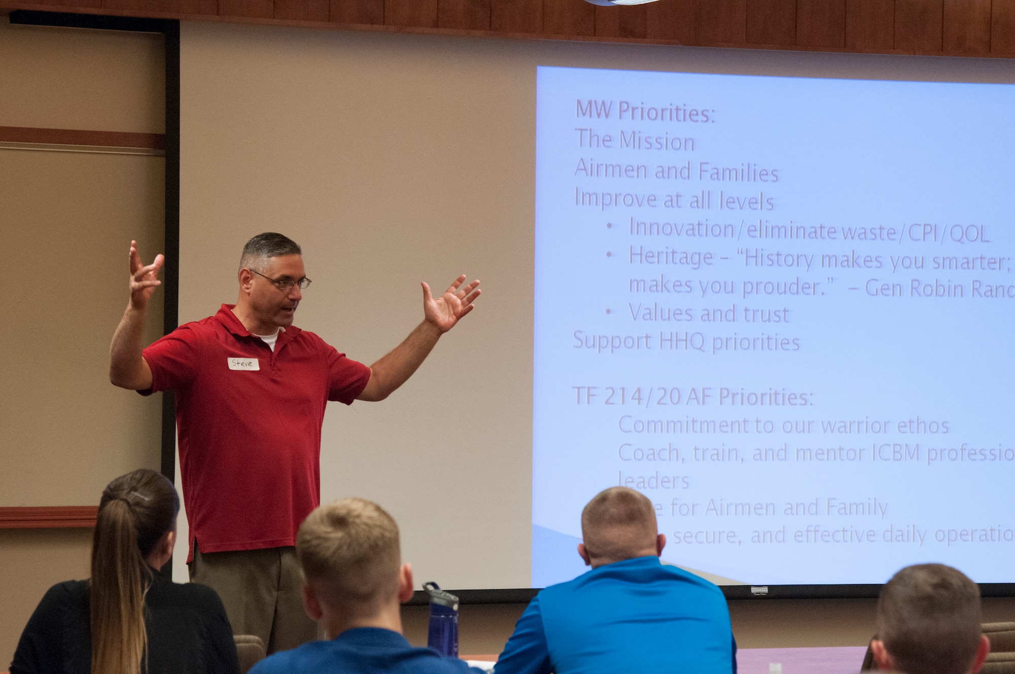 Col. Stephen Kravitsy, 90th Missile Wing commander, talks to the Airmen assembled in the Army Aviation Support Facility on F.E. Warren Air Force Base, Wyo., Sept. 9, 2015 at the “off-site,” organized to create new wing goals and a new wing vision. . (U.S. Air Force photo by Senior Airman Jason Wiese)