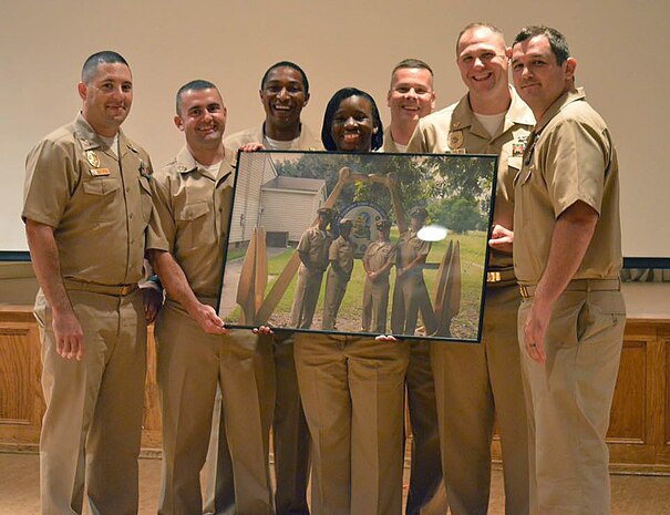 (left to right) Master-at-Arms Chief Petty Officer Rick Crowell, Electrician’s Mate Chief Petty Officer Thomas Byers, Mineman Chief Petty Officer David Toyloy, Logistic Specialist Chief Petty Officer Ashley Cooper, Yeoman Chief Petty Officer Chris Byrd, Fire Controlman Chief Petty Officer Rob McElroy, and Mineman Chief Petty Officer Michael Taylor pose for a group photo during this year’s Khaki Ball held at the Redbank Club, Joint Base Charleston – Weapons Station, Sept. 26, 2015. The event is held throughout the U.S. Navy each year to welcome the newly pinned Chiefs, their spouses and significant others into the Chiefs Mess. One of the proudest days in a Sailor’s life is the date when he or she dons the khaki uniform. (Courtesy Photo)
