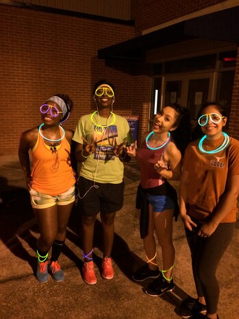 (left to right) Rebecca Castillo, Alia Burton, Choloe Wyatt, and Yolanda King pose for a photo prior to participating in this year’s annual Glow Run held at Joint Base Charleston – Weapons Station on Sept. 25, 2015. Over 100 runners participated in this year’s run. Andrew Chapman had the fastest time for males at 22 minutes and Emily Erdmann held the fastest time for females at just over 26 minutes. (U.S. Air Force photo/Laura Abell)