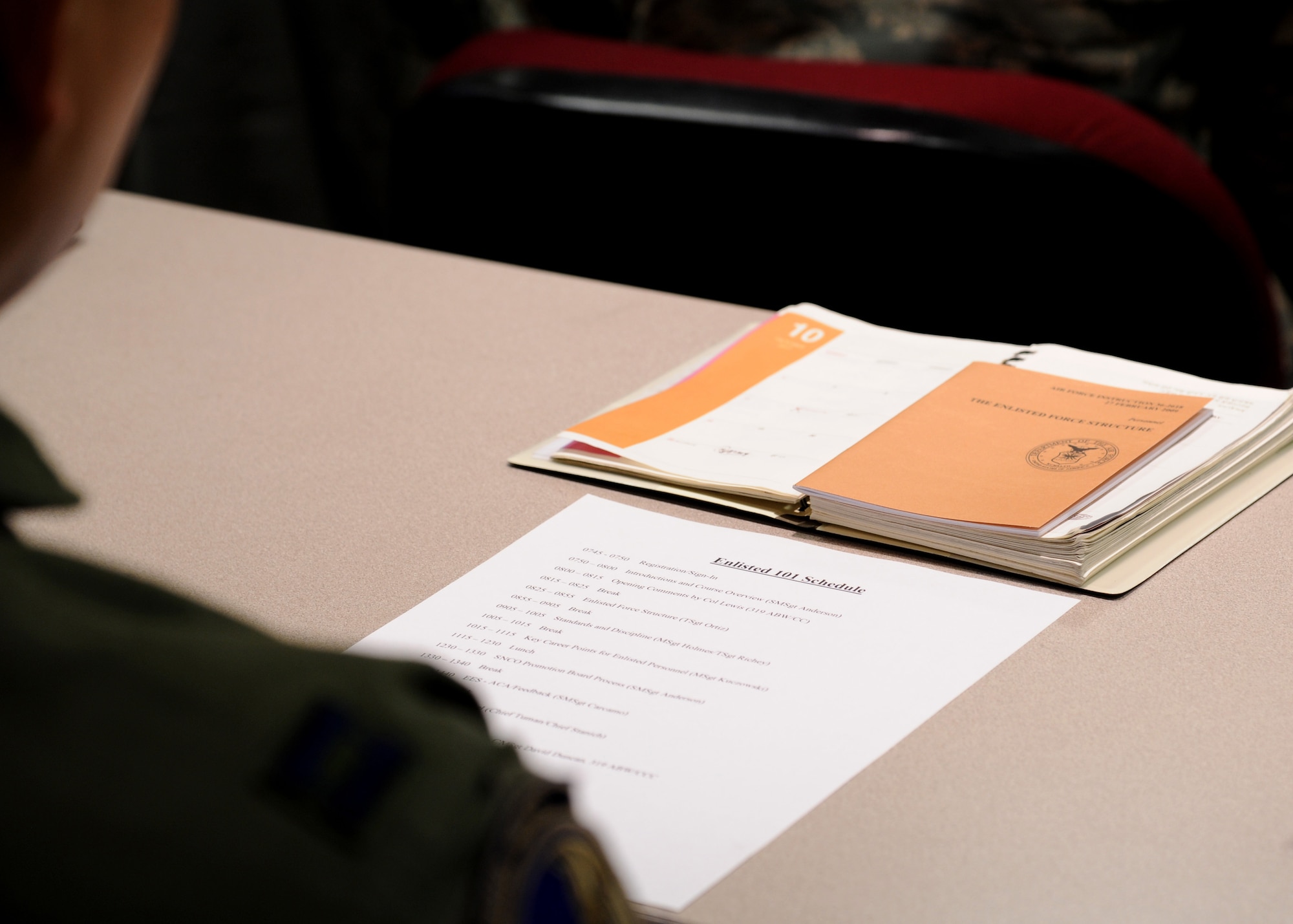 Air Force Instruction 36-2618, The Enlisted Force Structure, sits in front of a captain Sept. 29, 2015, on Grand Forks Air Force Base, North Dakota. ?The Little Brown Book? is given to new enlisted Airmen to outline their responsibilities by rank. Each company grade officer who attended the Enlisted 101 class on Grand Forks AFB was given a copy of the book to help them understand the enlisted force structure. (U.S. Air Force photo by Airman 1st Class Ryan Sparks/Released)