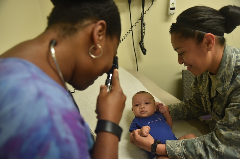 Katrina Barnes M.D., 779th Medical Operations Squadron, and Senior Airman Nancy Morency, 779th MDOS aerospace medical technician, examine a patient at the Pediatrics Clinic on Joint Base Andrews, Md., Sept. 24, 2015. The pediatrics team provides timely, quality care to beneficiaries’ children. (U.S. Air Force photo/ Airman 1st Class J.D. Maidens)