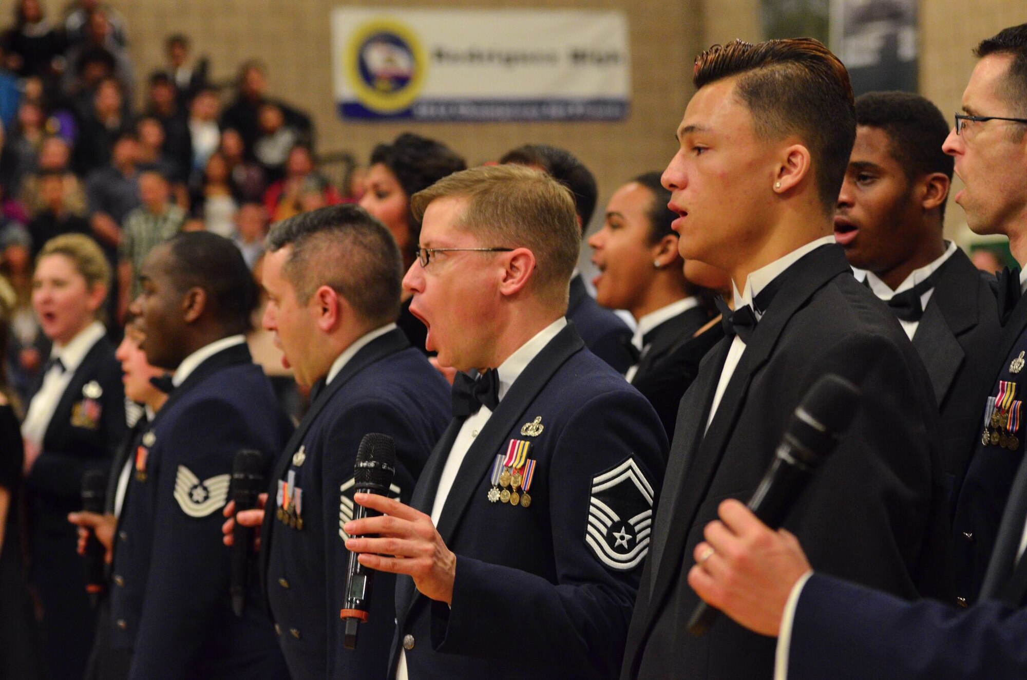 Members of the Singing Sergeants sing with high school students during a
performance in Fairfield, Calif. during the spring 2015 tour. (Air Force
photo by Senior Master Sgt. Bob Kamholz/released)
