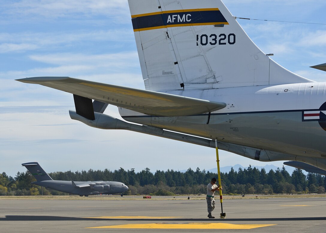 A 912th Aircraft Maintenance Squadron maintainer removes the tail stand off a KC-135 Stratotanker on Sept. 24 at Joint Base Lewis-McChord, Wash., in order to support the KC-46 Pegasus first flight. The KC-135 is attached to Edwards Air Force Base, Calif., but will intermittently fly out of JBLM in order to support KC-46 flight test operations throughout the next 11 to 15 months. (U.S. Air Force photo by Jet Fabara)