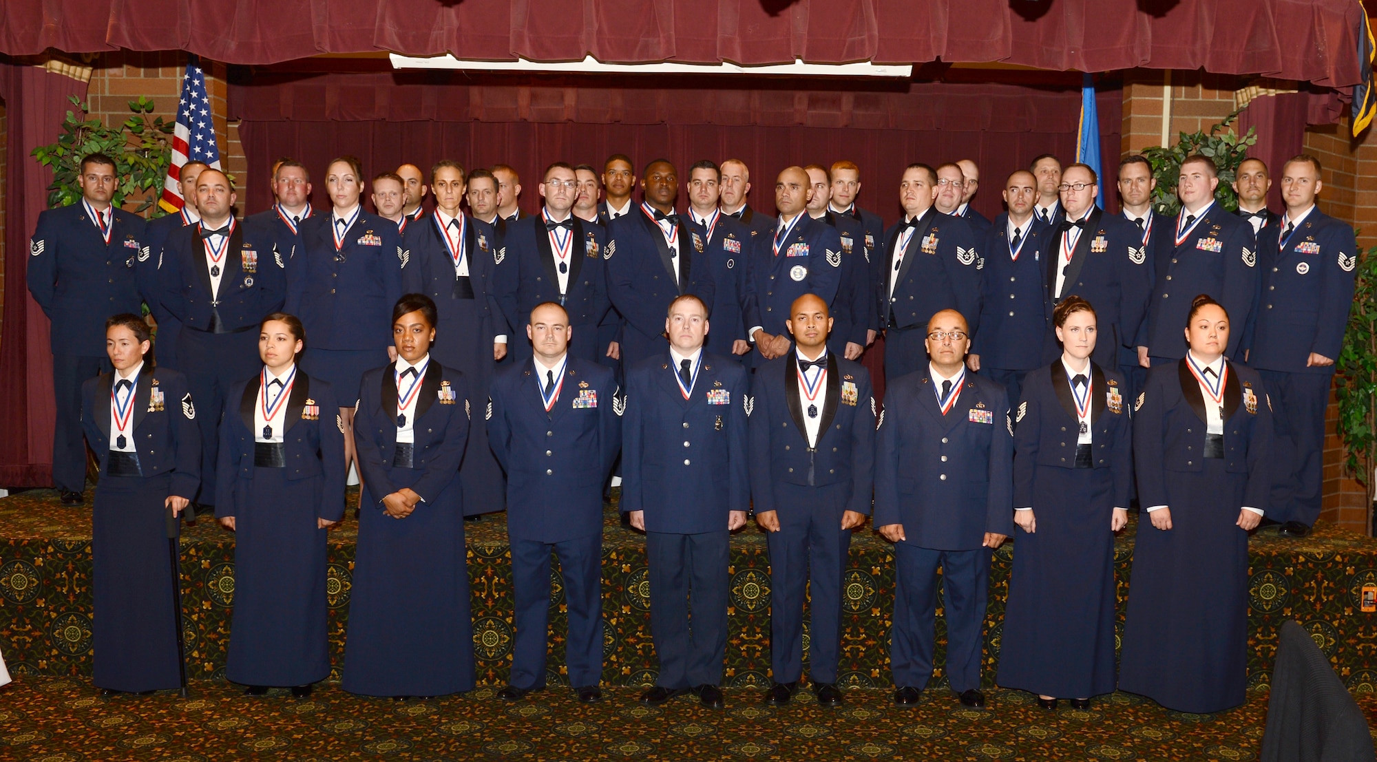Airmen from Joint Base Lewis-McChord pose for a photo during the senior noncommissioned officer inductee ceremony Sept. 25, 2015, at JBLM, Wash. The SNCO induction ceremony is a time tradition that recognizes Airmen who will be making the transition from NCO to SNCO. (U.S. Air Force photo/Senior Airman Divine Cox)