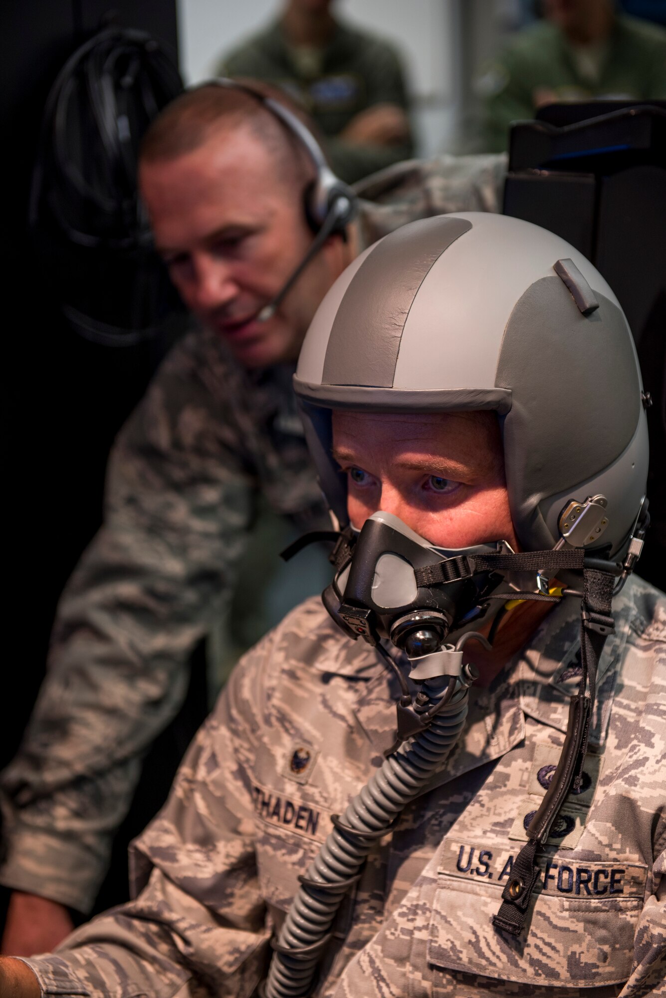 Col. Frederick D. Thaden, Joint Base McGuire-Dix-Lakehurst and 87th Air Base Wing commander, focuses on a virtual flight program while Capt. Michael Vastola, 87th Aerospace Medicine Squadron physiologist, monitors his breathing and pulse statistics during a demonstration of a hypoxia training system at JB MDL, N.J., Sept. 21, 2015. The new one-person simulator uses the flight program to distract the user while hypoxia is induced. (U.S. Air Force photo by Senior Airman Tara A. Williamson/Released)