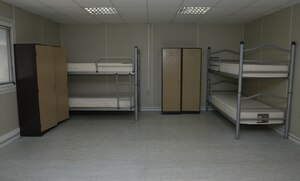 A room in Patriot Village is set up in an eight bed configuration Aug. 20, 2015, Incirlik Air Base, Turkey. Patriot Village is currently U.S. Air Forces in Europe’s largest contingency lodging arrangement and is capable of holding approximately 2,250 troops during surge capacity. (U.S. Air Forces photo by Senior Airman Krystal Ardrey/Released)