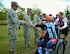 (From left to right) Chief Master Sgt. Paul G. Frisco Jr., 111th Attack Wing command chief, Michael Regan, Commander of the 111th ATKW's Mission Support Group, and Col. Howard Eissler, 111th ATKW  commander, high five cyclists participating in the Ride 2 Recovery's Army Navy Challenge as they pass through Newtown, Pennsylvania, on the third day of the week-long event. The affair raises money for injured veterans and began in New York City with and end point in Annapolis, Virginia. (U.S. Air National Guard photo by Tech. Sgt. Andria Allmond/Released)  