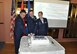 Capt. Ronald Kiser (left), 425th Air Base Squadron chaplain, Lt. Col. John Thomas, 425th ABS commander; and Senior Airman Samantha Albalos (right), 425th ABS security forces base defense operations center controller, cut the cake during the U.S. Air Force birthday celebration at the Izmir Club Sept. 18, 2015, at Izmir Air Base, Turkey.  It is tradition that the oldest and youngest members on base cut the cake during Air Force birthday celebrations. (U.S. Air Force photo by Tanju Varlikli)