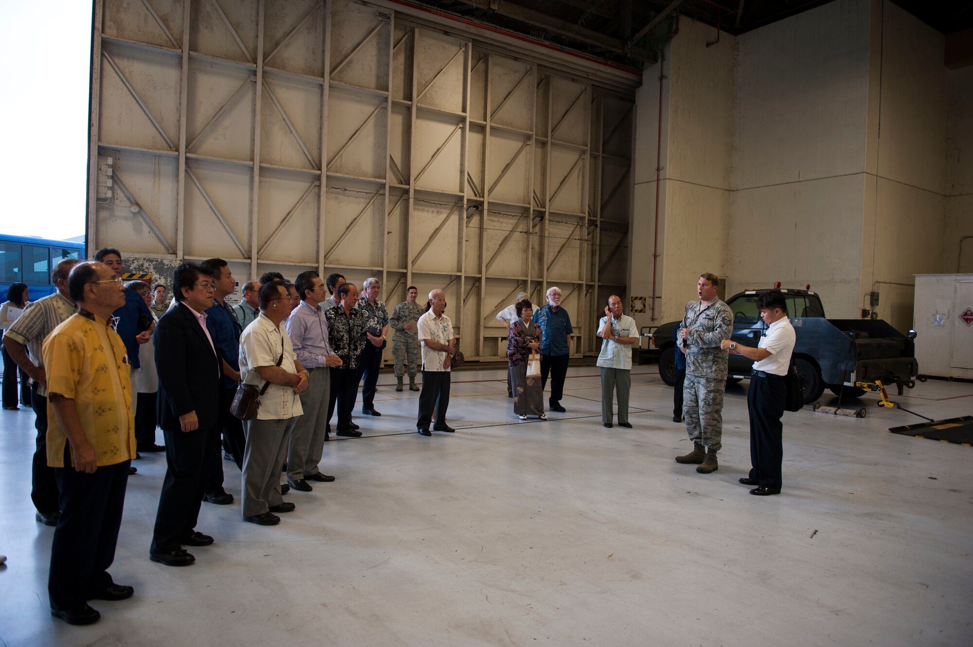 U.S. Air Force Tech. Sgt. Gary Dennis, 18th Equipment Maintenance Squadron Foreign Object Damage program manager, explains to Kadena’s honorary commanders the different processes that take place to prevent FOD from interfering with aircraft during an honorary commander tour Sept. 29, 2015, on Kadena Air Base, Japan. Dennis explained how it is every Airman’s job to ensure that the flightline is free from loose sand, rocks, fasteners, screws, metal and glass as part of a safety procedure. These safety precautions help the 18th Wing maintain strategic access and freedom of movement across all domains.  (U.S. Air Force photo by Airman 1st Class Lynette M. Rolen)