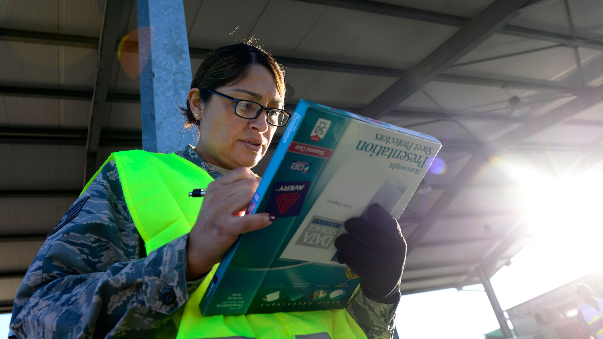 U.S. Air Force Staff Sgt. Maria De Leon, 31st Logistics Readiness Squadron traffic management office inbound cargo craftsman, consults a checklist during a cargo rodeo, Sept. 29, 2015, at Aviano Air Base, Italy. Cargo rodeos are conducted twice a year to exercise the 31st Fighter Wing Deployment Control Center’s deployment readiness. (U.S. Air Force photo by Senior Airman Areca T. Bell/Released)
