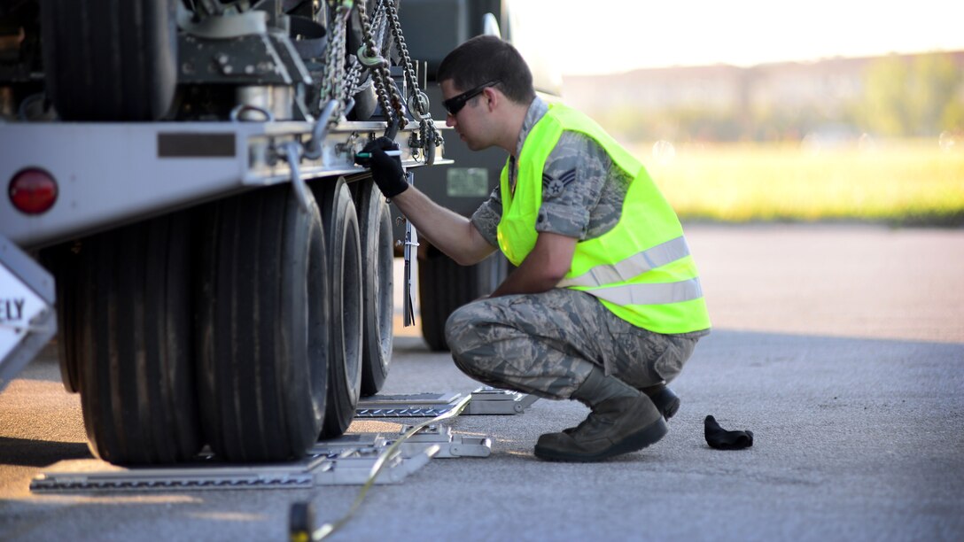 U.S. Air Force Senior Airman Lucas Jelinek, 31st Logistics Readiness Squadron traffic management office inbound cargo technician, inspects cargo during a cargo rodeo, Sept. 29, 2015, at Aviano Air Base, Italy. Cargo rodeos are conducted twice a year to exercise the 31st Fighter Wing Deployment Control Center’s deployment readiness. (U.S. Air Force photo by Senior Airman Areca T. Bell/Released)