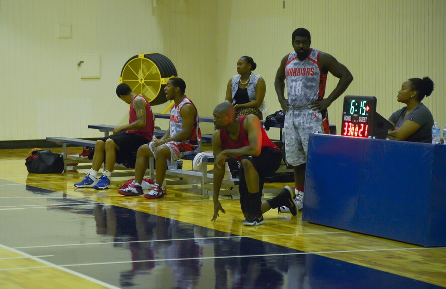 Two players wait to check into the game during the second quarter of a basketball game against the Saitama Hedges at Yokota Air Base, Japan, Sept. 26, 2015. The Warriors won 97-71. (U.S. Air Force photo by Senior Airman David Owsianka/Released)