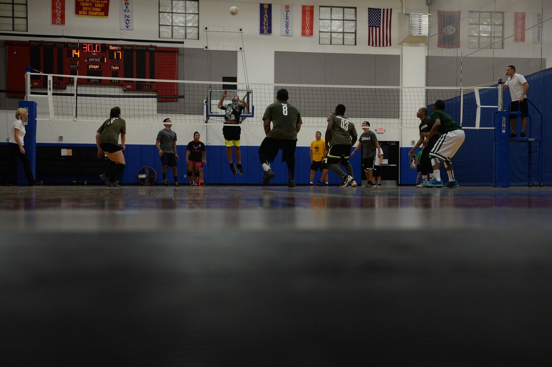Joshua Corpening, 36th Operations Support Squadron attempts to spike a ball during the 2015 intramural volleyball championship game Sept. 29, 2015, at Andersen Air Force Base, Guam. The 36th Security Forces Squadron’s team took home the first place trophy after winning 15-7 in the tiebreaker set. (U.S. Air Force by Senior Airman Joshua Smoot/Released)