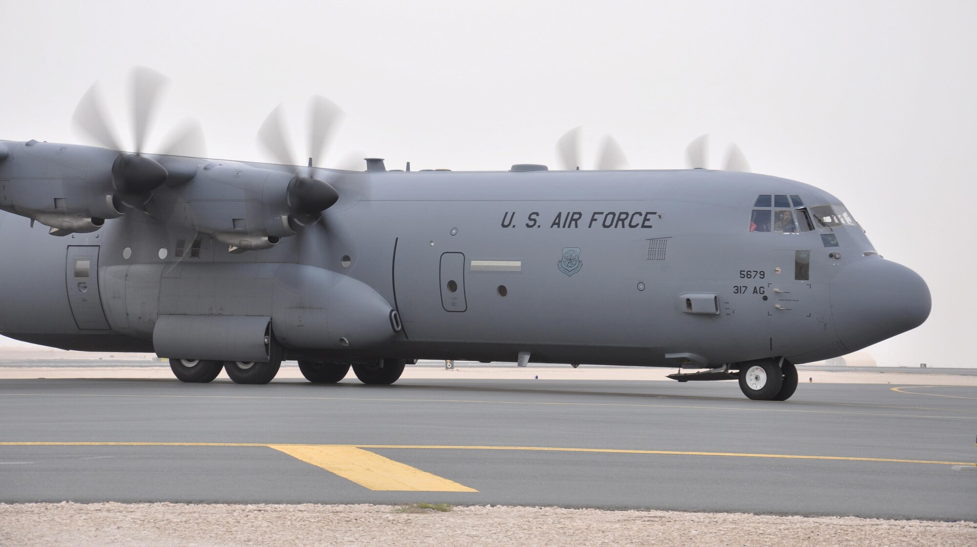 A C-130 from Dyess Air Force Base, Texas taxis to its parking spot after landing at Al Udeid Air Base, Qatar March 17. Ensuring aircraft can land safely is one of the many responsibilities of the 379th Expeditionary Operations Support Squadron’s Airfield Management team. The team inspects AUAB’s airfield every day, more than 49 million square feet of pavement. Any discrepancies that could interfere with flying operations are reported and dealt with quickly. In 2015, the team supported more than 20,000 sorties. (U.S. Air Force photo by Tech. Sgt. James Hodgman/Released)