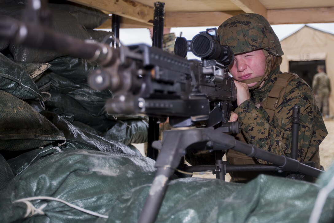 U.S. Marine Corps Cpl. Mackenzie M. Strampp, a clarinet player with the III Marine Expeditionary Force band, sights into a M240B machine gun prior to CPX 16, on Okinawa, Japan, Jan. 29, 2016. CPX 16 is conducted to improve the III MEF’s capabilities in intelligence and logistic operations, future planning, and combat readiness. (U.S. Marine Corps photo by MCIPAC Combat Camera Lance Cpl. Juan Bustos/ Released)