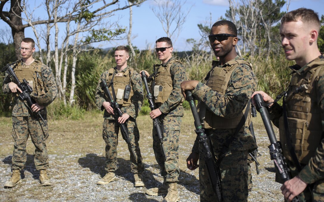 U.S. Marines with 3D Intelligence Battalion, III Marine Expeditionary Force Headquarters Group, and III MEF Band pay attention to instructions on Camp Hansen, Okinawa, Japan, Jan. 31, 2016. CPX 16 is conducted to improve the III MEF’s capabilities in intelligence and logistic operations, future planning, and combat readiness. (U.S. Marine Corps photo by MCIPAC Combat Camera Lance Cpl. Christian J. Robertson/Released)