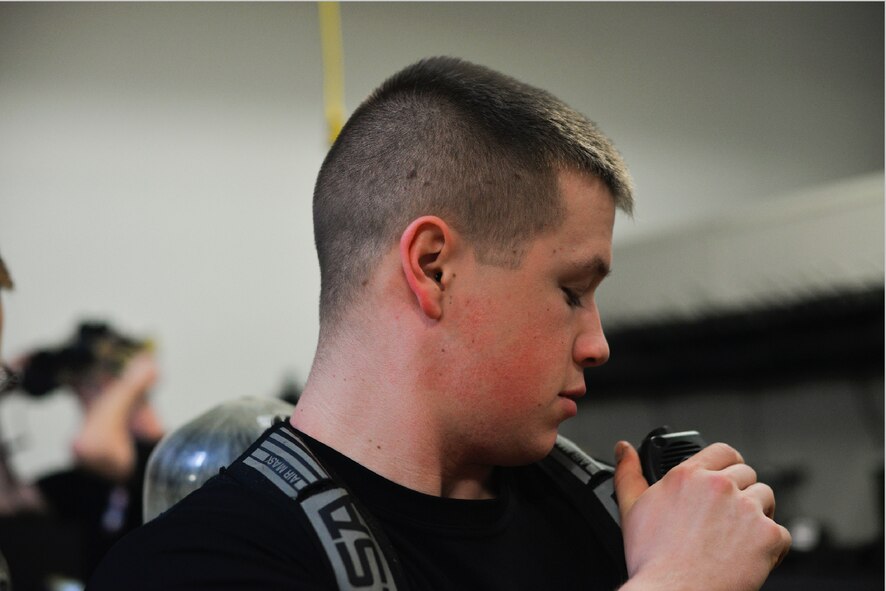 Airman 1st Class Justin Eason, 51st Civil Engineer Squadron emergency management logistics, prepares his oxygen tank before donning a hazardous material suit Feb. 5, 2016, at Osan Air Base, Republic of Korea. Eason and the EM team ensure their equipment are ready in case they need to respond to a contingency or natural disaster. (U.S. Air Force photo by Senior Airman Dillian Bamman/Released)