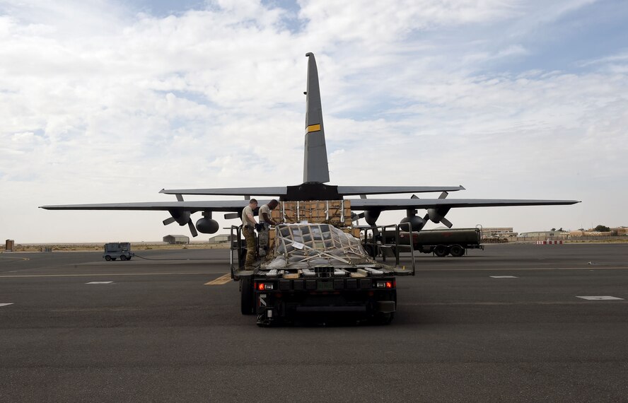 Airmen assigned to the 386th Expeditionary Logistics Readiness Squadron’s aerial port flight verify a cargo load prior to transport at an undisclosed location in Southwest Asia, March 14, 2016. The aerial port flight supports cargo and personnel movement into and out of the area of responsibility to include Afghanistan, Jordan and Iraq. (U.S. Air Force photo by Staff Sgt. Jerilyn Quintanilla)