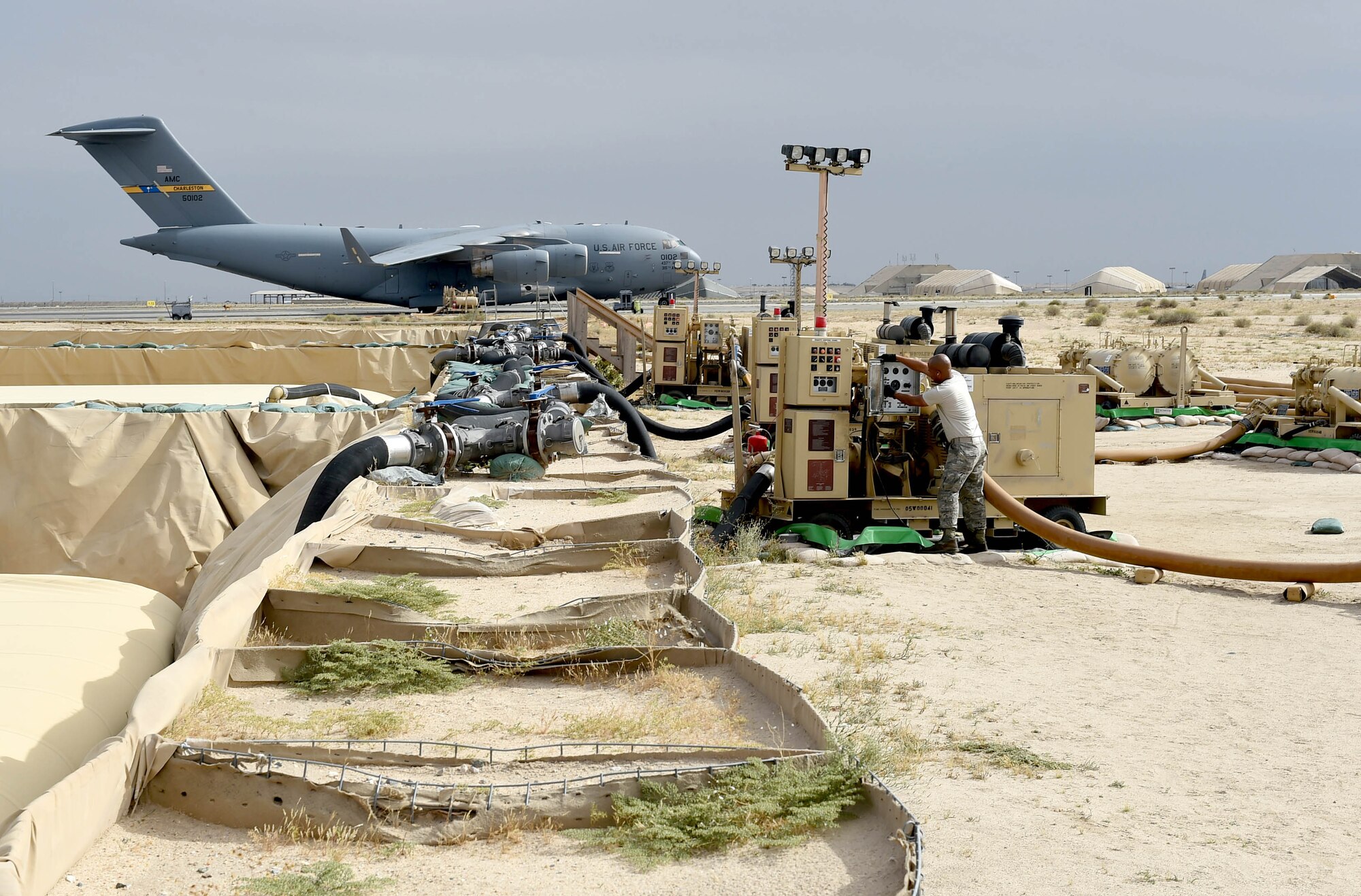 Senior Airman Kervin Tellado, a 386th Expeditionary Logistics Readiness Squadron fuels journeyman, shuts down a JP-8 fuel pumping component at an undisclosed location in Southwest Asia, March 14, 2016. The more than 1.8 million gallons of fuel on the installation is distributed to U.S. and coalition forces vehicles and aircraft supporting Operation INHERENT RESOLVE. (U.S. Air Force photo by Staff Sgt. Jerilyn Quintanilla)