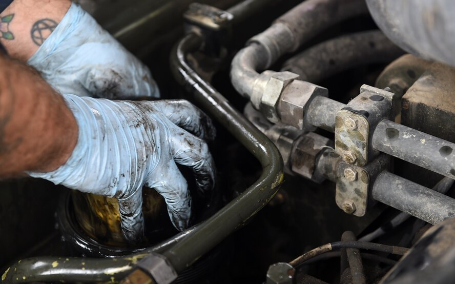 Staff Sgt. Dane Childers, a 386th Expeditionary Logistics Readiness Squadron material handling equipment mechanic, replaces a 60K cargo loader fuel filter at an undisclosed location in Southwest Asia, March 15, 2016. The material handling equipment section of the vehicle maintenance flight is responsible for maintaining and servicing heavy equipment on base such as fire trucks, cargo loaders, and forklifts. (U.S. Air Force photo by Staff Sgt. Jerilyn Quintanilla)